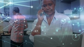 Animation of network of connections over senior african american couple. Global business and digital interface concept digitally generated video. - Powered by Shutterstock - Get 15% off with code: PIKWIZARD15