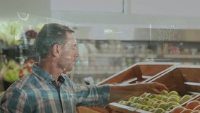 A man is picking fruit in a supermarket the animation shows a stock market display with numbers and graphs the price is going up and down at the stock exchange the globe is spinning and screens are - Powered by Shutterstock - Get 15% off with code: PIKWIZARD15