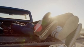 Animation of network of connections with icons over diverse couple in car by sea. Global travel, vacation, connections, computing and data processing concept digitally generated video. - Powered by Shutterstock - Get 15% off with code: PIKWIZARD15