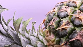 Whole fresh pineapple fruit with green crown rotating slowly - Powered by Shutterstock - Get 15% off with code: PIKWIZARD15