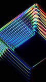Rotating futuristic ribbed glass cube with light refraction and prismatic color dispersion. Futuristic glass form rotating in darkness, bending light into vibrant rainbow gradients. Minimal abstract glass with smooth rotation motion and prismatic light effects. Crystal clear geometry interacting with light. Abstract translucent geometry in motion for innovation, digital art and modern visual. Seamless looped 4K video. 3d render - Powered by Shutterstock - Get 15% off with code: PIKWIZARD15