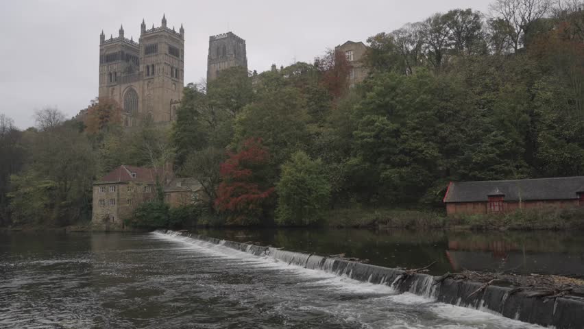 Iconic view of Durham Cathedral and the weir on the River Wear taken in autumn