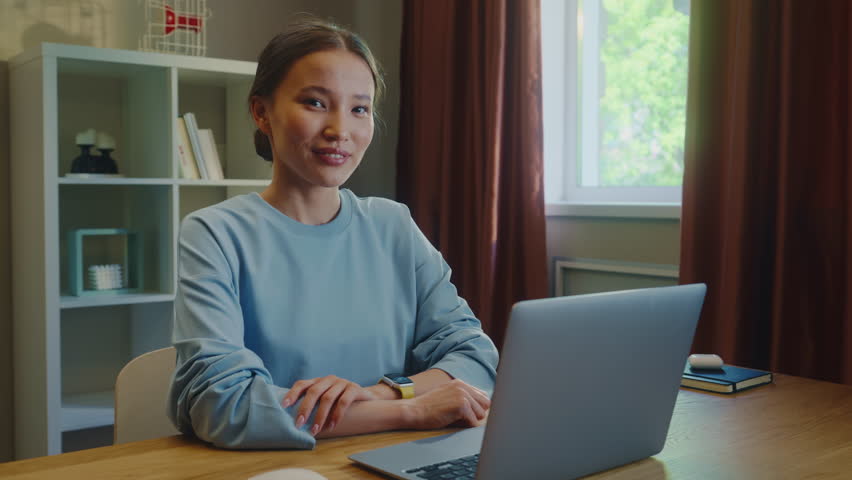 Confident happy asian woman worker work laptop home. Successful girl look at camera smile. Female employee portrait. Busy ceo person use pc. Online education student. Computer freelancer. Distant job.