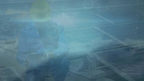 Animation of network of connections over caucasian male worker and solar panels. Global connections, computing and digital interface concept digitally generated video. - Powered by Shutterstock - Get 15% off with code: PIKWIZARD15