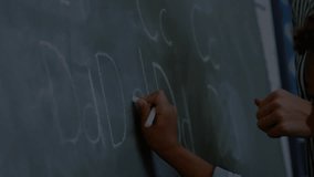 Animation of data processing over diverse schoolchildren by chalkboard in classroom. Global education, business, connections, computing and data processing concept digitally generated video. - Powered by Shutterstock - Get 15% off with code: PIKWIZARD15