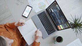 Time-lapse of a financial analyst reviewing data and charts, analyzing markets, business strategy, investment planning, and corporate finance workflow. - Powered by Shutterstock - Get 15% off with code: PIKWIZARD15