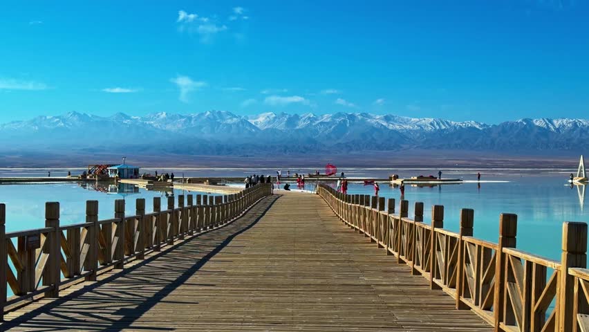 Boardwalks At Chaka Salt Lake (Cha Ka Yan Hu) In Qinghai Province In China. Panning Shot