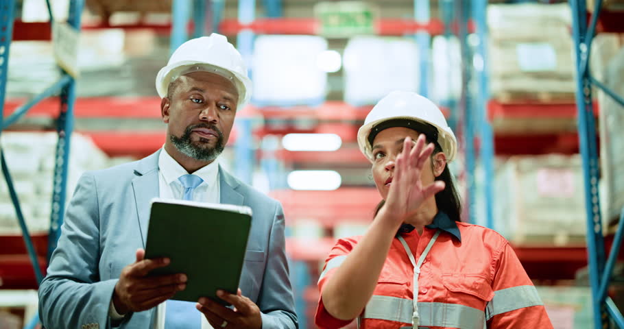 Man, woman and tablet with team discussion at warehouse, logistics or point for shipping solution. People, inspection and talk with tech, application or storage for supply chain at distribution plant