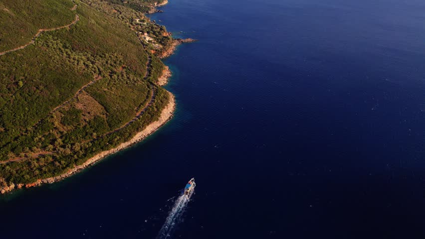 Aerial view of boat near coastline, Greece.