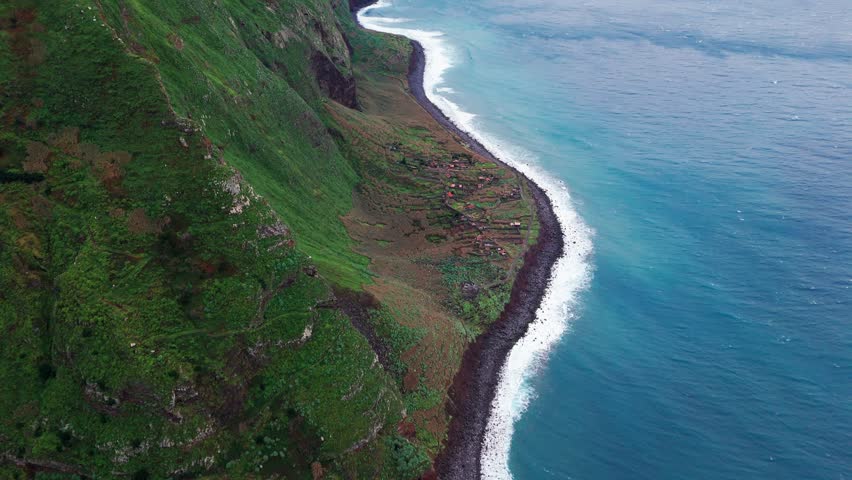Seaside landscape imagery, Skyhigh view of lively beach and lush cliffs