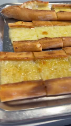 Turkish pide with melted cheese, close up, commonly used as food background or copy space video