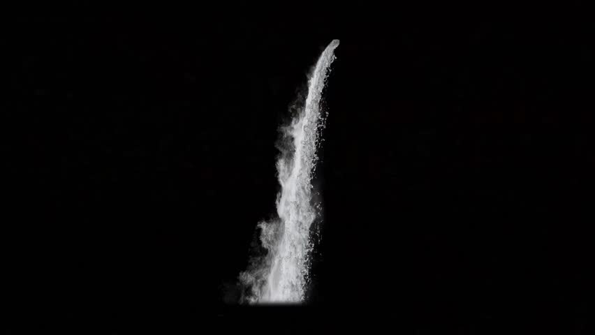 A powerful vertical jet of white water is shooting upward in dark space, creating a dramatic natural splash and mist effect. Clean energy and motion concept. Seamless looping 4K video background