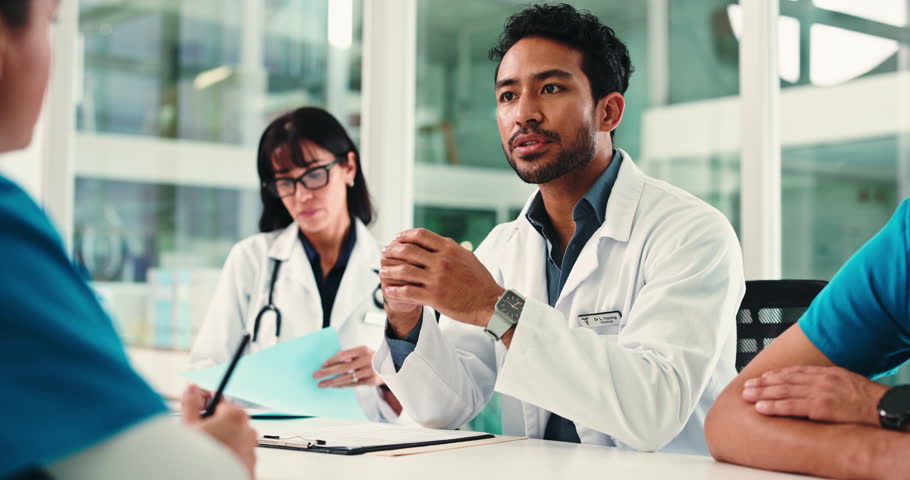 Healthcare, doctors or discussion in office, medical case review or writing notes for insurance filing. People, hospital committee or physician in team meeting for health cover info, talk or process