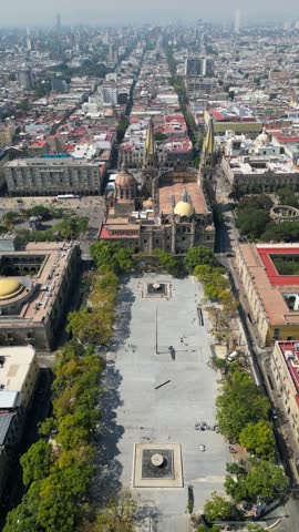 Guadalajara, Mexico - November 8 2025: Drone view captures Guadalajara Cathedral and Tapatia Square under renovation. Historic site surrounded by vibrant city architecture