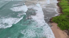 Aerial view of continuous ocean waves crashing on a tropical sandy beach - Powered by Shutterstock - Get 15% off with code: PIKWIZARD15