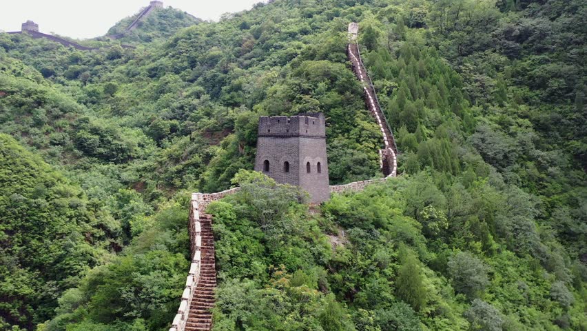 This video presents the magnificent Great Wall of China winding across China’s great rivers and mountains, showcasing the spectacular and grand beauty of this world-famous cultural heritage and national landmark. It captures the ancient great wall standing on green mountain peaks, blending the grandeur of ancient architecture with the stunning scenery of China’s vast and magnificent natural landscape, ideal for China tourism promotions and cultural heritage content.