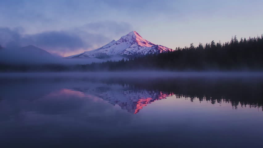 Breathtaking 4K UHD aerial time-lapse footage of snow-capped mountain ranges, sunlit Golden Peaks, and majestic plateau glaciers, showcasing the raw beauty of high-altitude alpine landscapes. Capturing golden hour light gilding snow peaks, drifting cloud seas over frozen glaciers, and rugged ice cliffs glistening in sunlight, the video embodies the grandeur of plateau wilderness. Perfect for Shutterstock users—ideal for travel promotions, adventure campaigns, nature documentaries, and commercial projects seeking visually striking alpine scenery.