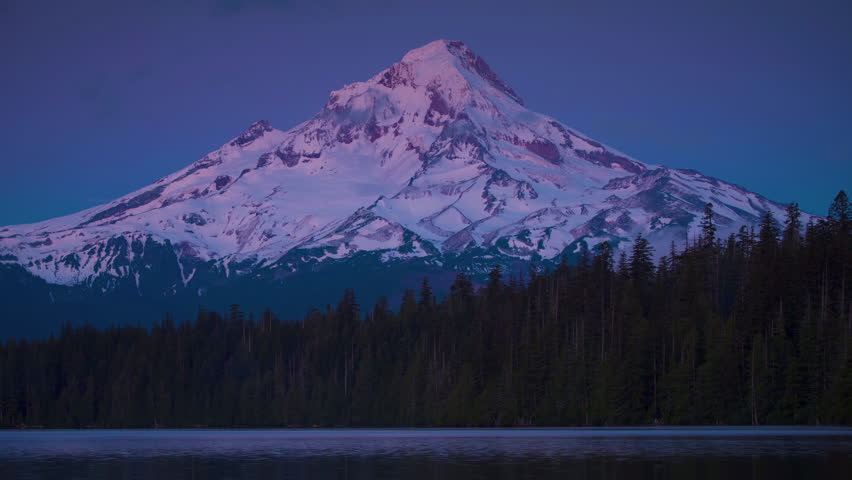 Breathtaking 4K UHD aerial time-lapse footage of snow-capped mountain ranges, sunlit Golden Peaks, and majestic plateau glaciers, showcasing the raw beauty of high-altitude alpine landscapes. Capturing golden hour light gilding snow peaks, drifting cloud seas over frozen glaciers, and rugged ice cliffs glistening in sunlight, the video embodies the grandeur of plateau wilderness. Perfect for Shutterstock users—ideal for travel promotions, adventure campaigns, nature documentaries, and commercial projects seeking visually striking alpine scenery.
