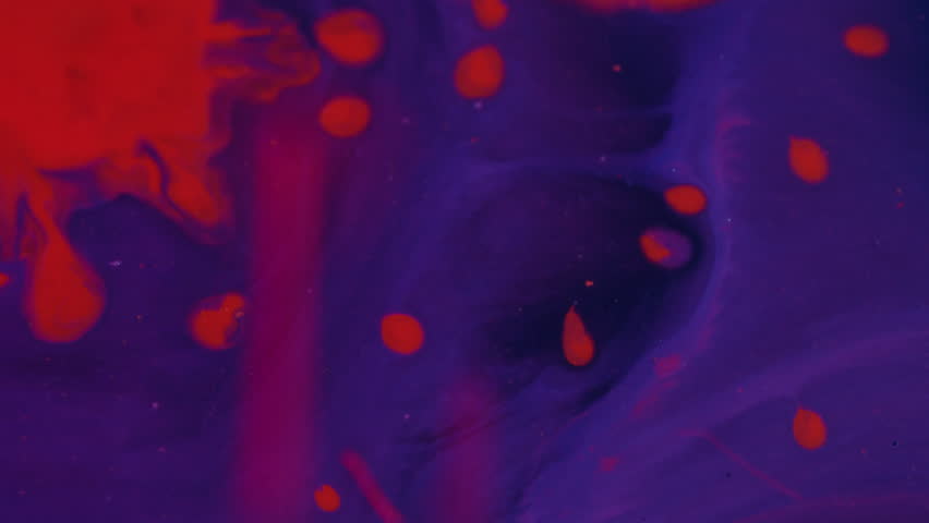 Spill spatter. Paint background. Defocused red blue purple color water texture flowing bright liquid spreading on creative acrylic abstraction.