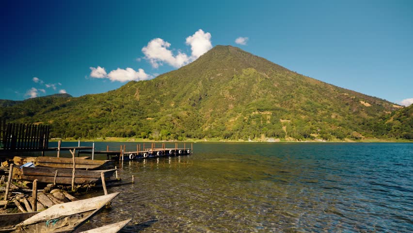 Calm lakeside view of San Pedro Volcano rising above Lake Atitlán