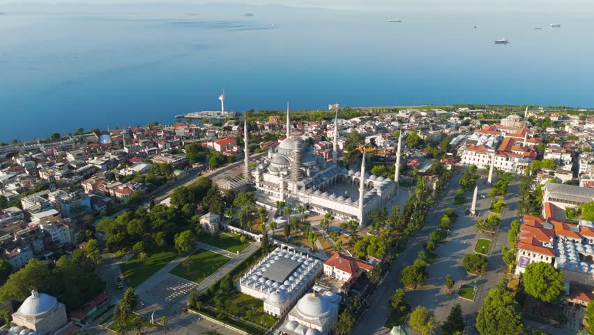 Istanbul, Turkey. Blue Mosque at Sultanahmet Square in morning sun. Aerial view of Ottoman architecture with minarets against Bosphorus. Aerial View, MasterShots, Circle (Far)