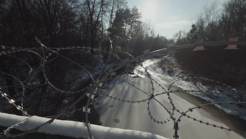 Border Security Protection And Restricted Area. Dangerous Military Barrier. Forbidden Zone Entrance, Tactical Defense Installation. Sharp Razor Wire Fence . Protective Enclosure For Private Property