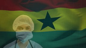 Animation of flag of ghana over caucasian doctor with face mask. Global patriotism, pandemic and digital interface concept digitally generated video. - Powered by Shutterstock - Get 15% off with code: PIKWIZARD15