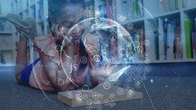 Student lying on library floor tapping tablet creating rotating globe exploring tech network icons. Digital, innovation, educational, futuristic, immersive, interactive, creativity - Powered by Shutterstock - Get 15% off with code: PIKWIZARD15