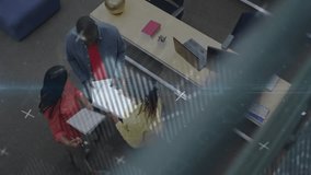 Team gathering at desk triggers swapping binders and reviewing business charts with animated graphs. Collaboration, teamwork, data analysis, business strategy, professional environment, digital - Powered by Shutterstock - Get 15% off with code: PIKWIZARD15