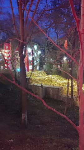 Outdoor staircase at night illuminated with warm lights. Urban architecture detail, steps leading upward, calm evening atmosphere.