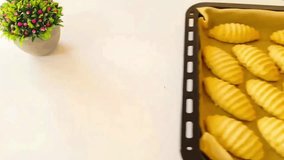 Powdered sugar sprinkling on fresh homemade ribbed cookies on a baking tray - Powered by Shutterstock - Get 15% off with code: PIKWIZARD15