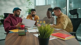 Diverse creative informal office business team collaborating in workspace African woman discussing online data with Asian Indian colleagues men four agents analyzing charts planning innovative startup - Powered by Shutterstock - Get 15% off with code: PIKWIZARD15