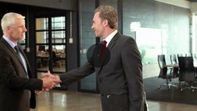 Animation of network of connections with icons over business people in office. Global business, finance and data processing concept digitally generated video. - Powered by Shutterstock - Get 15% off with code: PIKWIZARD15