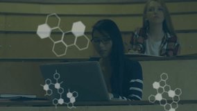 Animation of scientific data processing over diverse students using laptops. Global education, business, connections, computing and data processing concept digitally generated video. - Powered by Shutterstock - Get 15% off with code: PIKWIZARD15