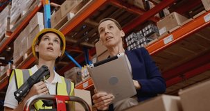 Manager pointing shelf and guiding tech scanning stock while icons showing business metrics. Supply chain, warehouse, logistics, technology, data visualization, sustainability, industry - Powered by Shutterstock - Get 15% off with code: PIKWIZARD15