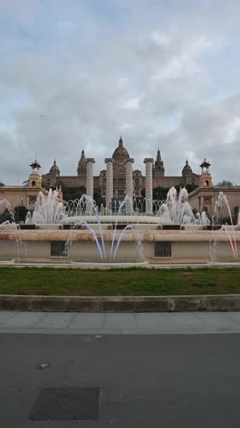 Magic Fountain of Montjuic in Barcelona with cloudy sky