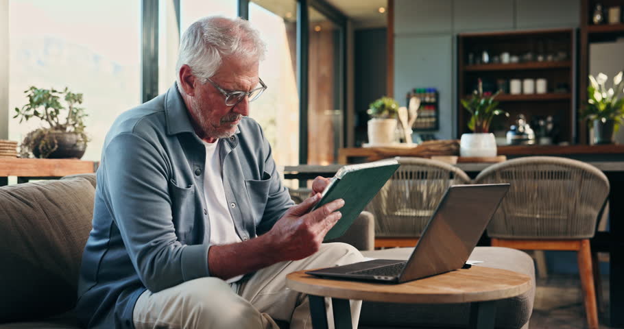 Tablet, laptop and fail with old man on sofa for mortgage debt, retirement funds and glasses. Online banking, vision fatigue and foreclosure notice with senior person in home for pension account