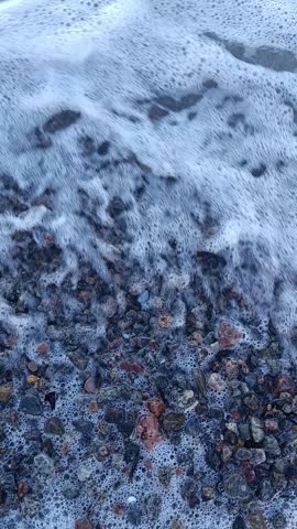 sea ​​waves on a shore of small stones