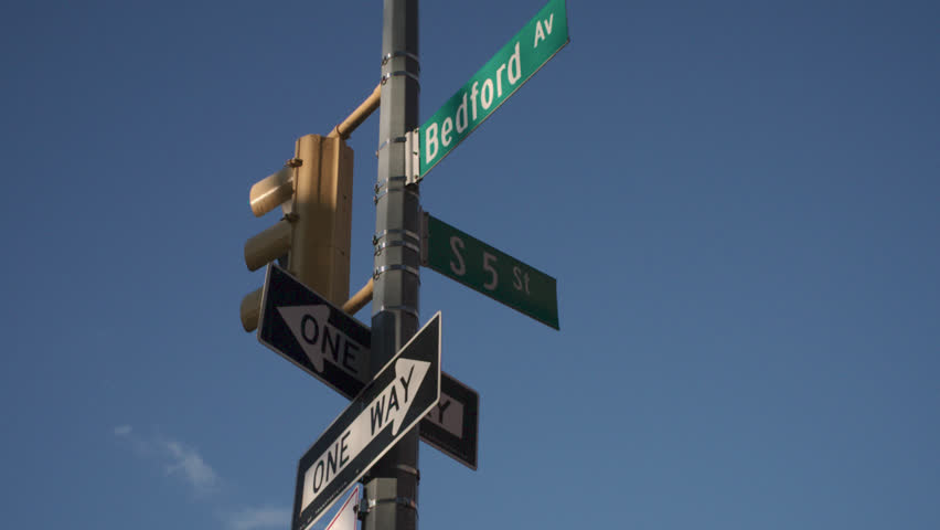 Tracking shot of a street corner in Williamsburg, Brooklyn. Shot on Bedford Avenue on an autumn morning.