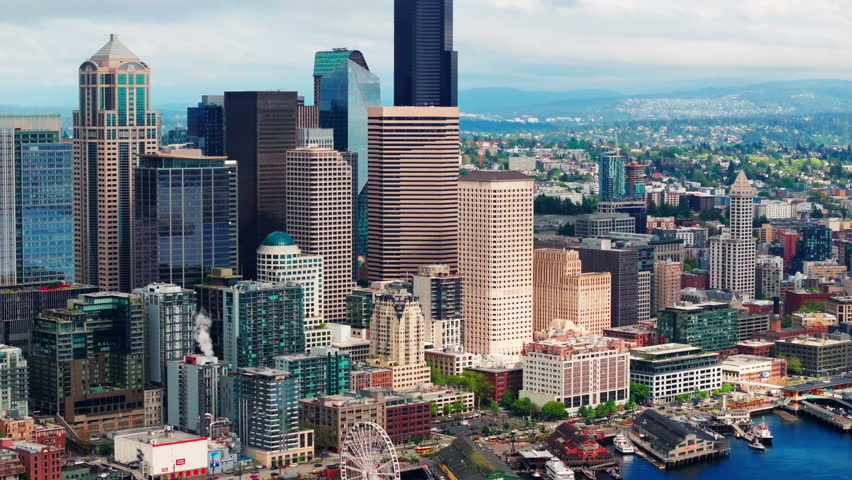 Aerial drone view of downtown Seattle, showcasing skyscrapers, urban streets, and the city skyline from above. Ideal for travel and urban cityscape footage