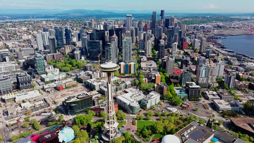 Aerial view over Seattle, Washington, USA, capturing the downtown skyline, urban landscape, and surrounding city environment from above. Ideal for travel and cityscape footage