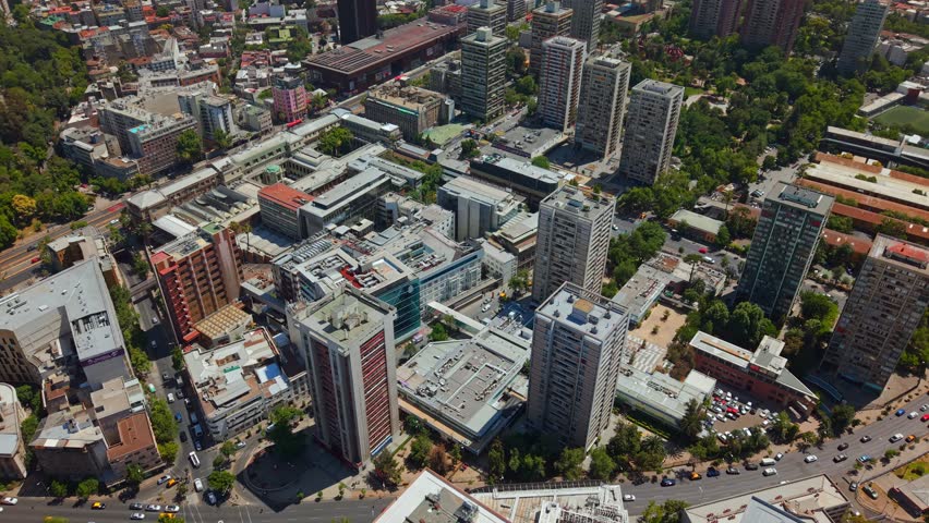 Drone Establishing fly Santiago de Chile City Center Rooftops with UC CHRISTUS Hospital