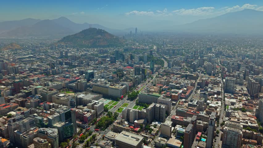 Aerial fly La Moneda Presidential Palace with Alameda Avenue and Panoramic View of Santiago de Chile