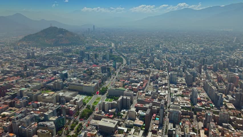 Aerial establishing fly Santiago de Chile central city, urban landscape, Andean Cordillera background