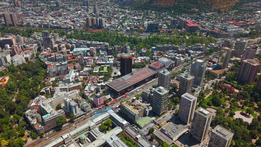 Drone fly Santiago de Chile Cityscape with Traffic at GAM Cultural Center and Lastarria Neighborhood