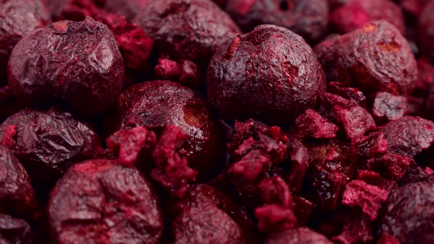 Red whole freeze dried cherry berries circle rotation close up