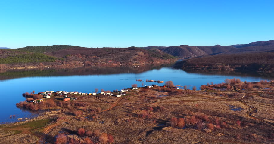 Dam in winter in hot sunny day, aerial view