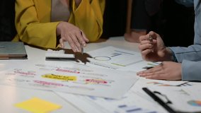 Business professionals collaborating in a meeting, analyzing data, and brainstorming a business plan - Powered by Shutterstock - Get 15% off with code: PIKWIZARD15