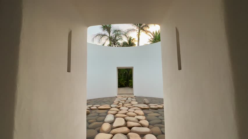 Walking through villa hallway to open area