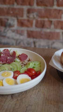 Simple salad with eggs and meats in a restaurant